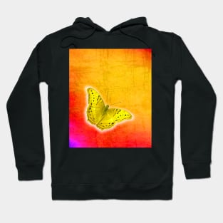 Glowing yellow butterfly on vibrant textured background Hoodie